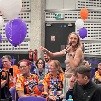 Paula presenting a live performance of her podcast after the London Marathon